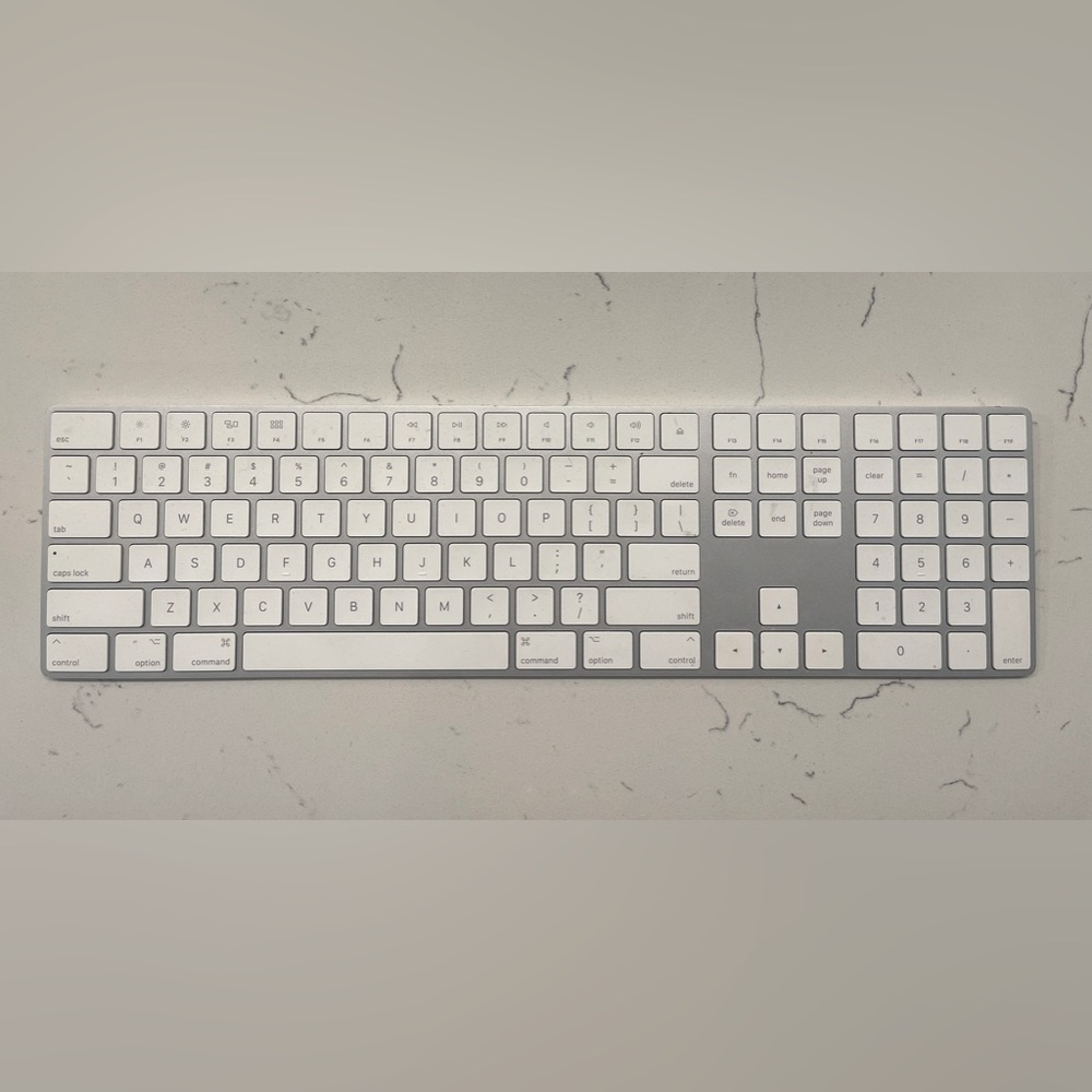 HOME OFFICE BUNDLE - Apple keyboard, mouse, laptop stand, and monitor extension.